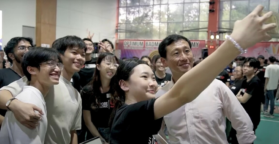 Students posing with a minister