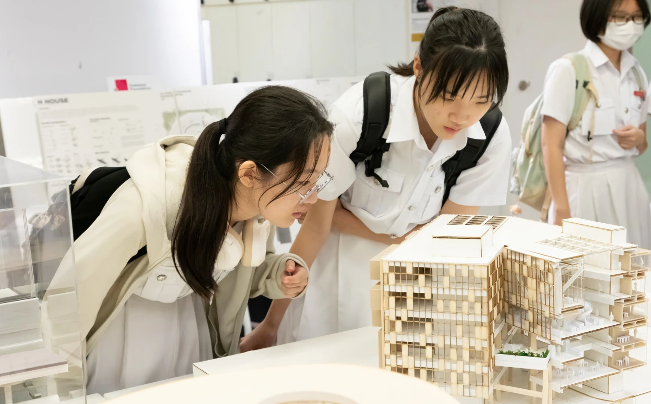 Student looking at model