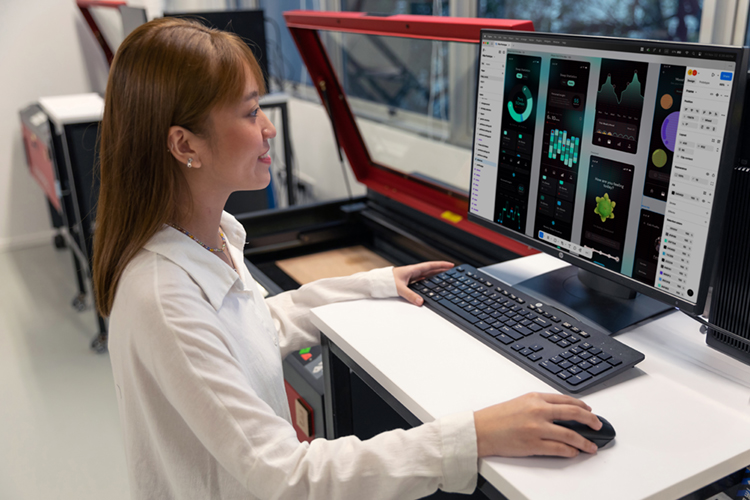 student using a laser machine